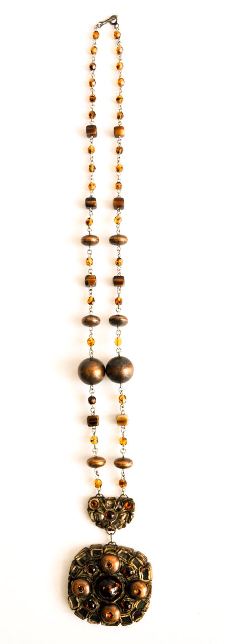 A vintage necklace by the French jewelry designer Henry. A contemporary of Line Vautrin, Henry is also known for his innovative combination of resin and various beads in creating costume jewelry. Marked 