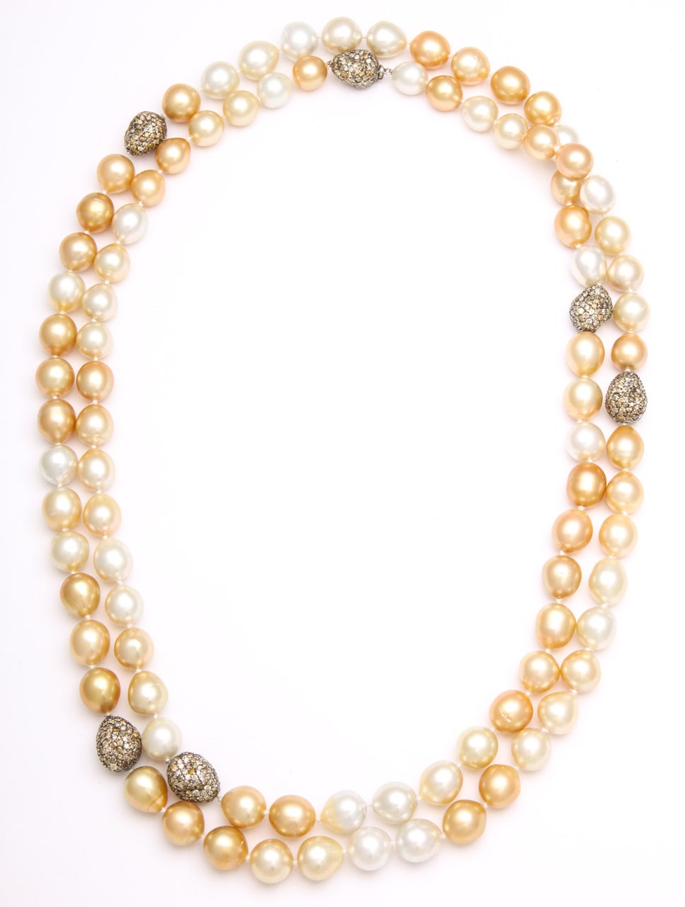Natural Philippian South Sea Pearls ranging from 11-13 mm with touches of diamond nuggets weighing approximately 16.5 carats.