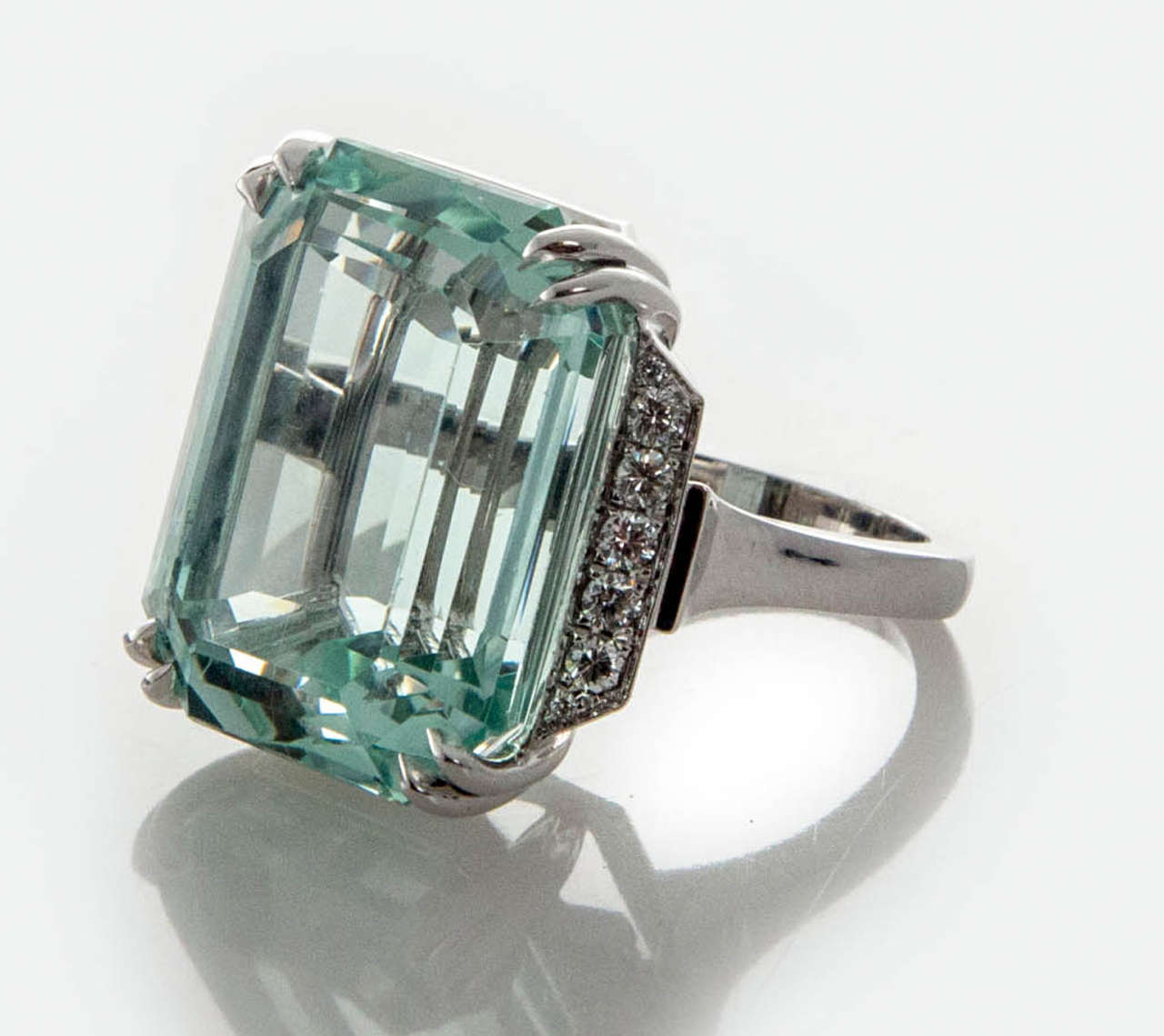 Fantastic Art Deco Emerald step cut natural Aqua ring Circa 1940. Looks even bigger than its 36.50ct size because of the distinctive step cutting. Heavy Platinum setting in simple deco style. This greenish blue color with small natural inclusions is