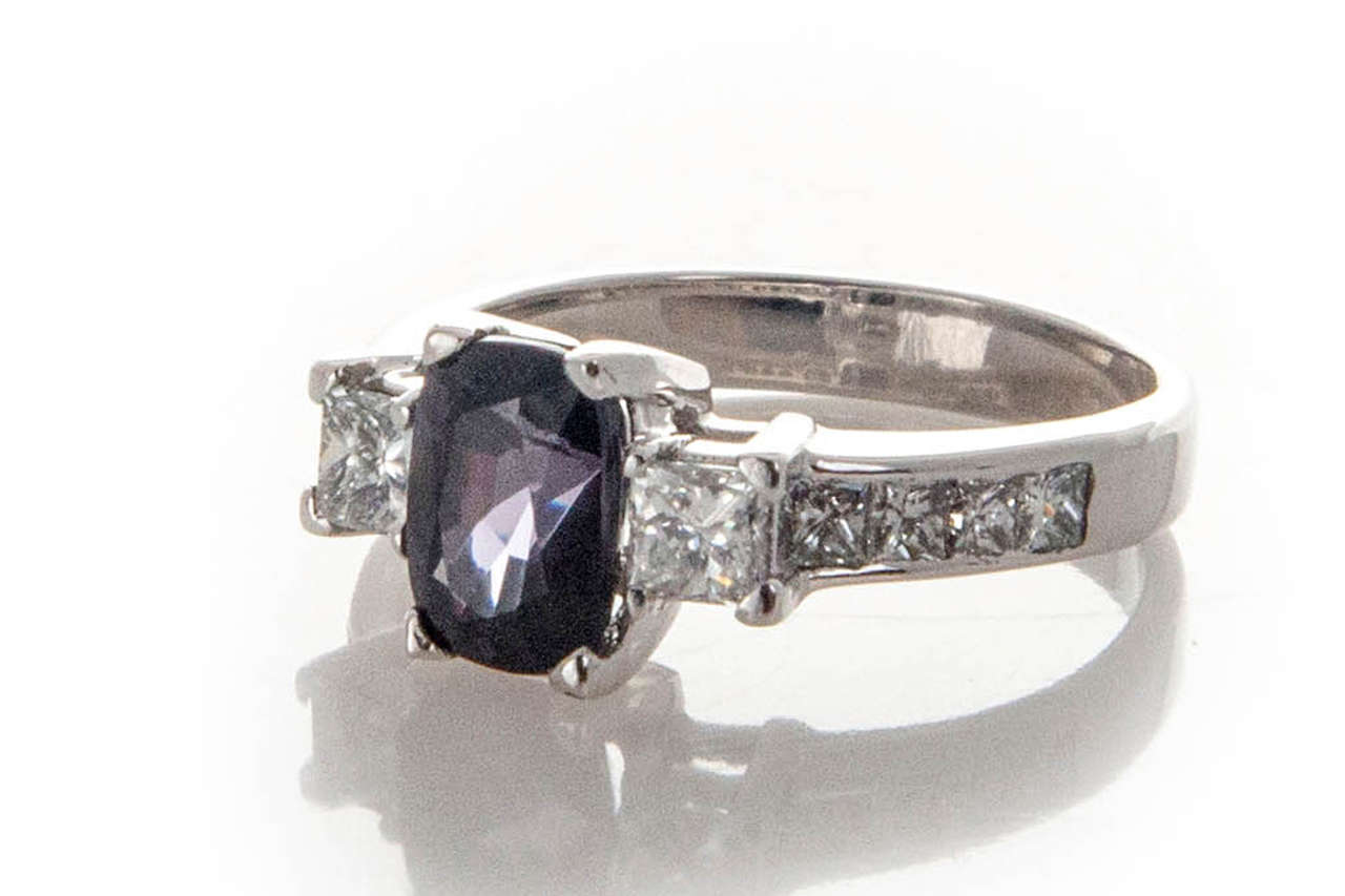 Estate 14k white gold ring with Platinum center set with a rare certified deep purple cushion cut Spinel. Princess cut bright sparkly sides.

14k White gold and Platinum
1 cushion cut genuine dark purple Spinel, approx. total weight 1.74cts,