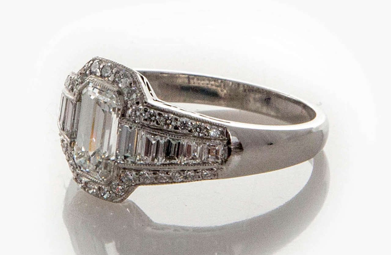 Totally handmade top quality solid Platinum ring from Sophia D. Set with Ideal cut F, VS side diamonds.  The center diamond is GIA certified 1.12ct emerald cut with a pleasing length to width ratio. G color and VS2 clarity. The side baguettes