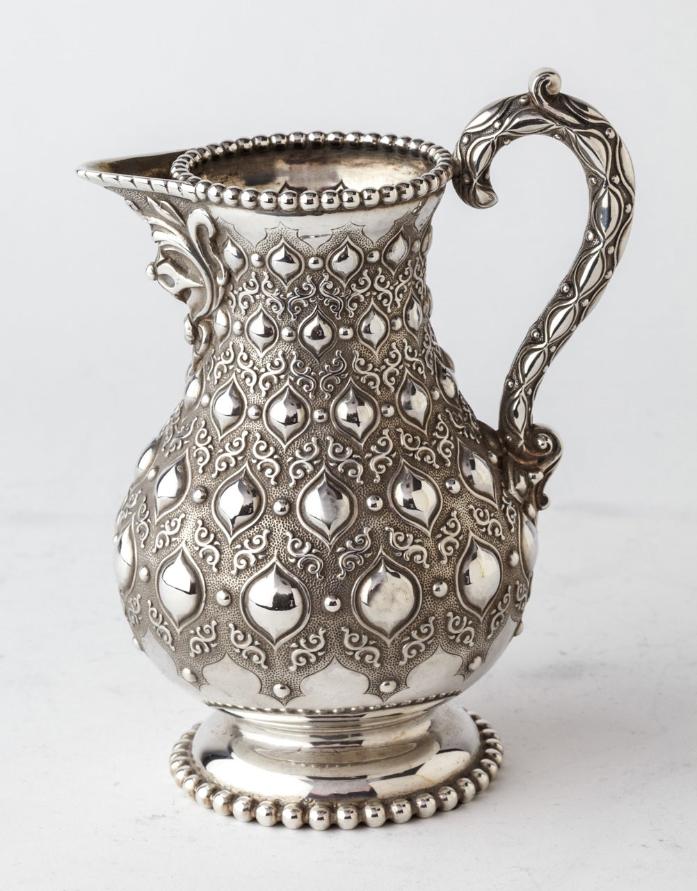 The tea and coffee set is of an extraordinary good quality and design, entirely hand made and hallmarked London 1865 by Robert Hennell
coffee pot 11.5 inches height
tea pot 9 inches
sugar basin 5.3 inches
milk jug 5.5 inches