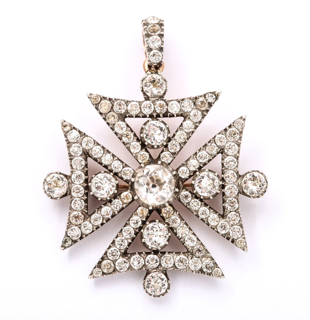 After years, (they show up rarely) with cheers, we offer a rock crystal maltese cross with clear, brilliant foiled stones.  The center stone is black dot in the style of an old mine diamond. Silver front to blend with the white crystal with no