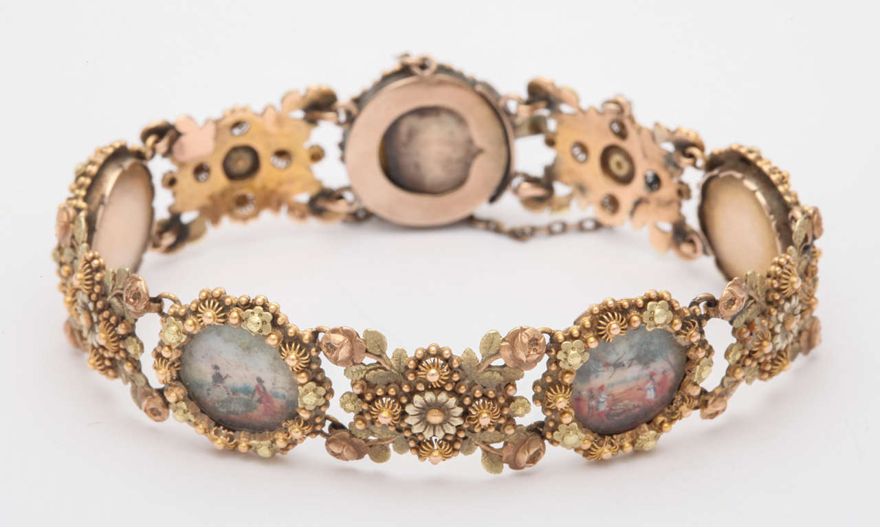 Beautiful handmade 18kt Yellow Gold Filigiree Bracelet made of Rosettes and spirals and solid gold backs.  Truly a magnificent piece of work.
   Miniatures are painted on vellum with amazing vignettes of local life.  Like wearing a travelogue on