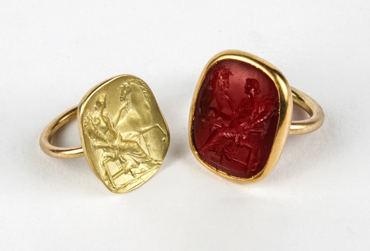 The first ring is in 18 and 22K gold and is set with a carnelian intaglio representing Fortuna Matens, seated with a cornucopia and holding the reins of a horse, Florence, 1740-1760 (Provenance: collection of Robertson Davies, 1913-1995). The second