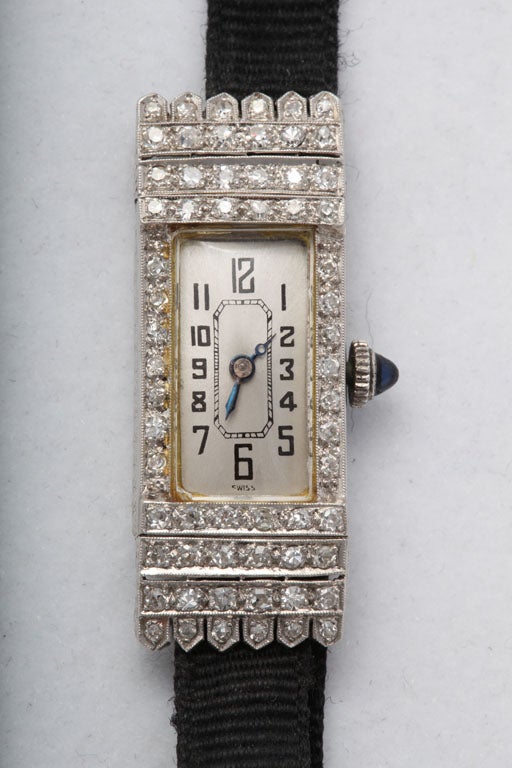 Very elegant Platinum & Diamond Art Deco design dress watch with Gros Grain Band.  Expandable to fit.