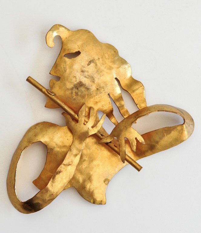 Sculptural brooch by the French designer Herve Van Der Straeten. The faun-like design of the flutist is reminiscent of Cocteau.
A desirable, early work by Van Der Straeten.
