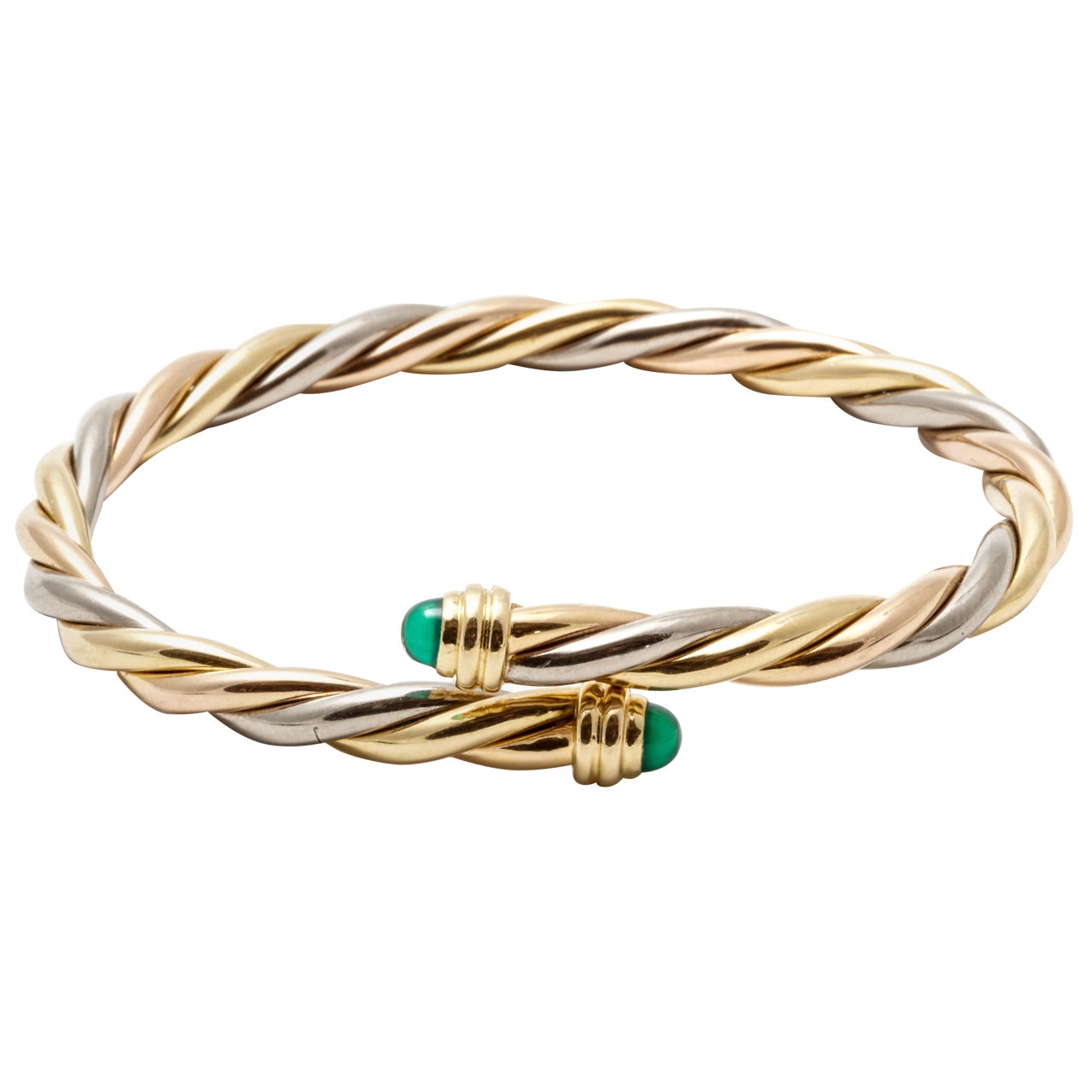 A tri-colour golden torsade bracelet by Cartier For Sale