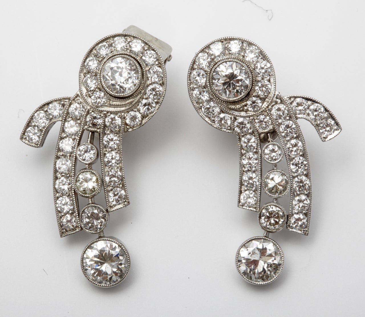 A pair of diamond ear pendants
