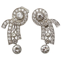 A pair of diamond ear pendants