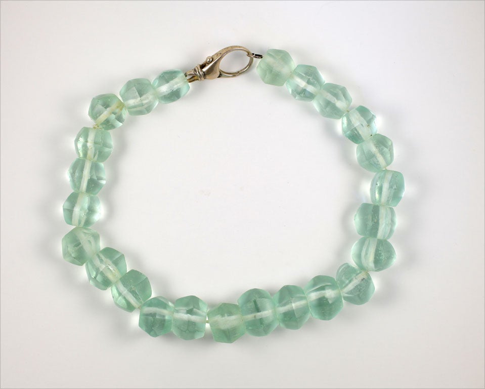 Graduated, faceted aqua glass beaded necklace.  Largest bead is 1  1/4