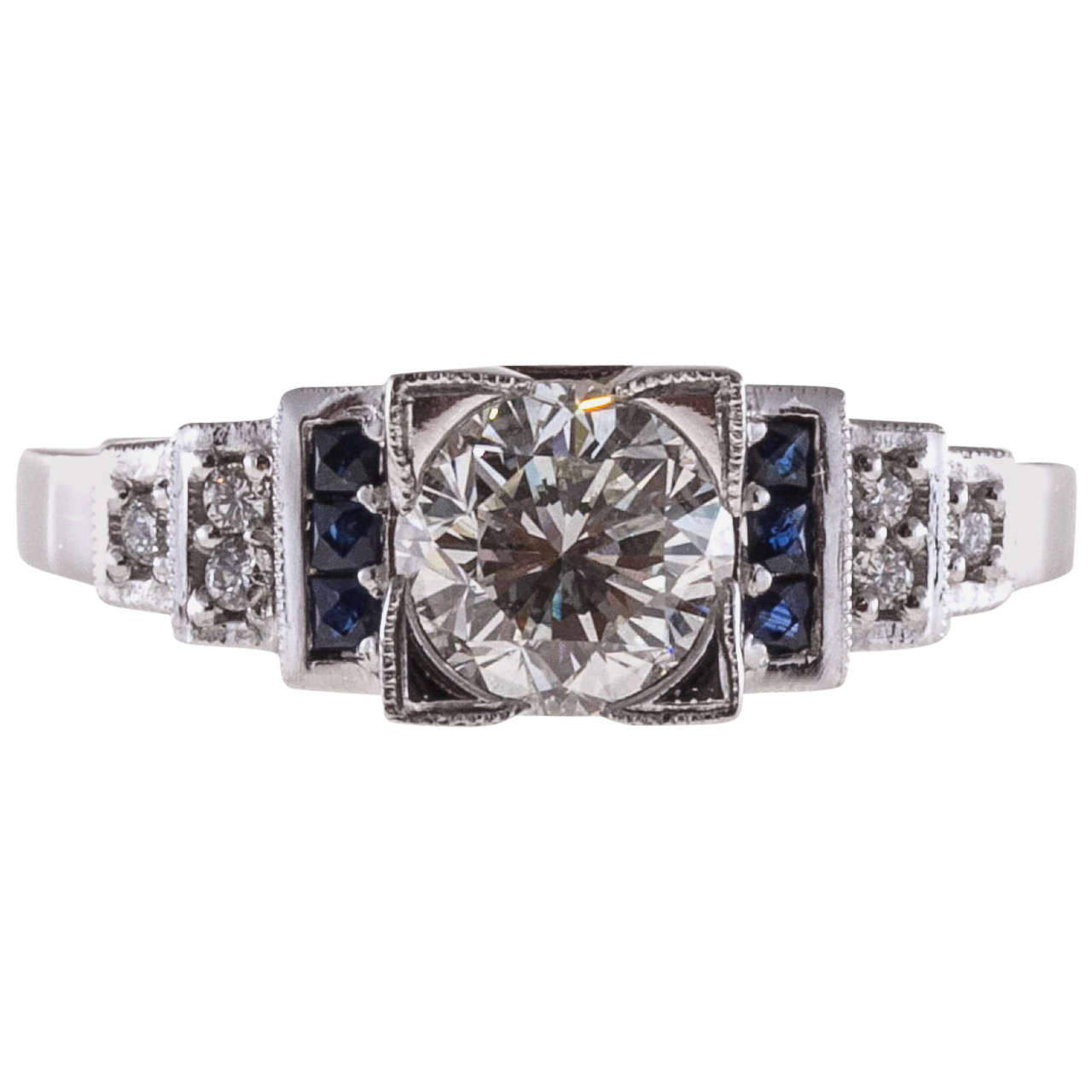 Old European cut diamond and round sapphire engagement ring. GIA certified white face up and very bright because of the cut. The platinum setting is a custom made Peter Suchy design.

1 old European cut round diamond, approx. total weight 1.00cts, I