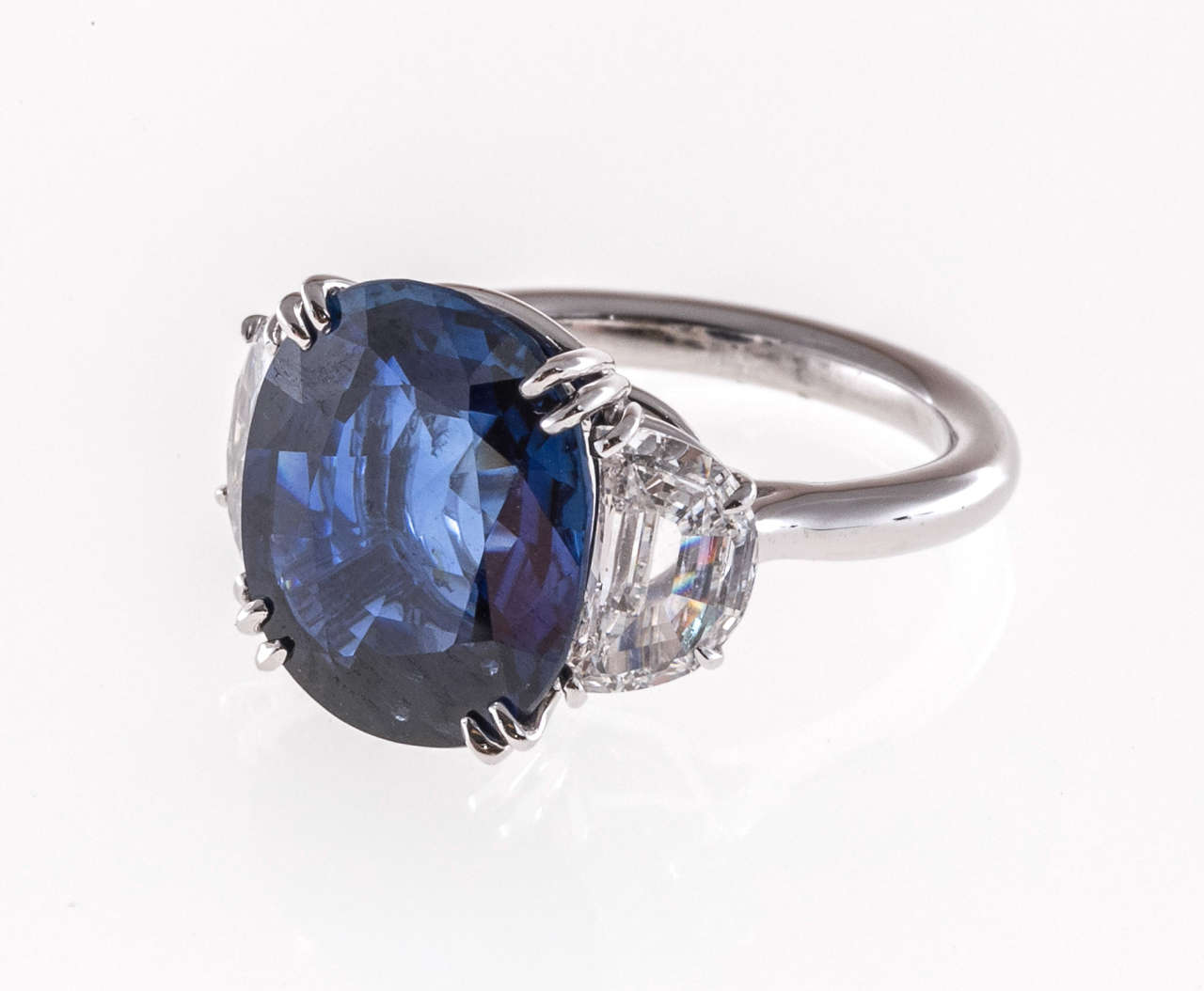 Top gem Sapphire ring circa 1940-1950. First the center stone, 7.94cts of top gem cornflower blue extra fine color. Not cut excessively deep. In fact the top is the size of most 10ct to 12ct Sapphires with no loss of brilliance. GIA certified