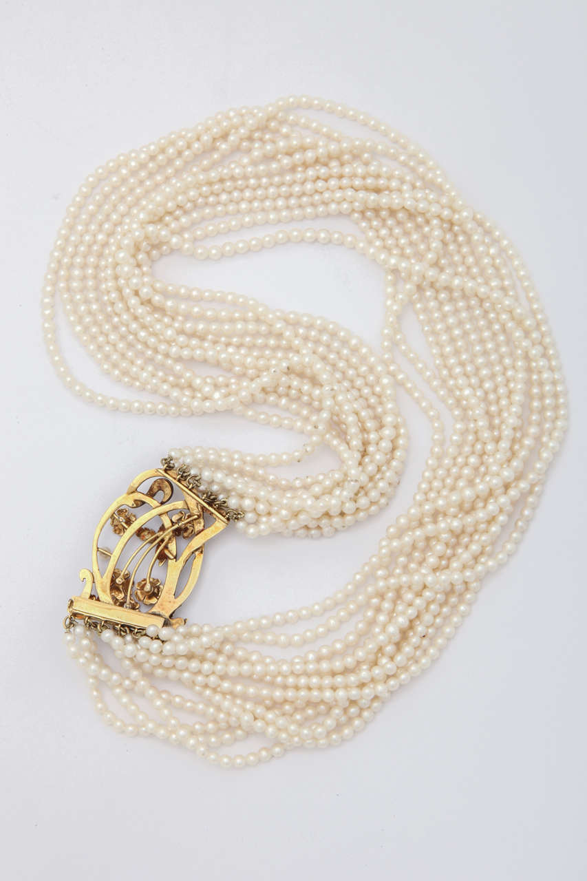 Elegant Multistrand Pearl Gold Floral Clasp Necklace For Sale 1