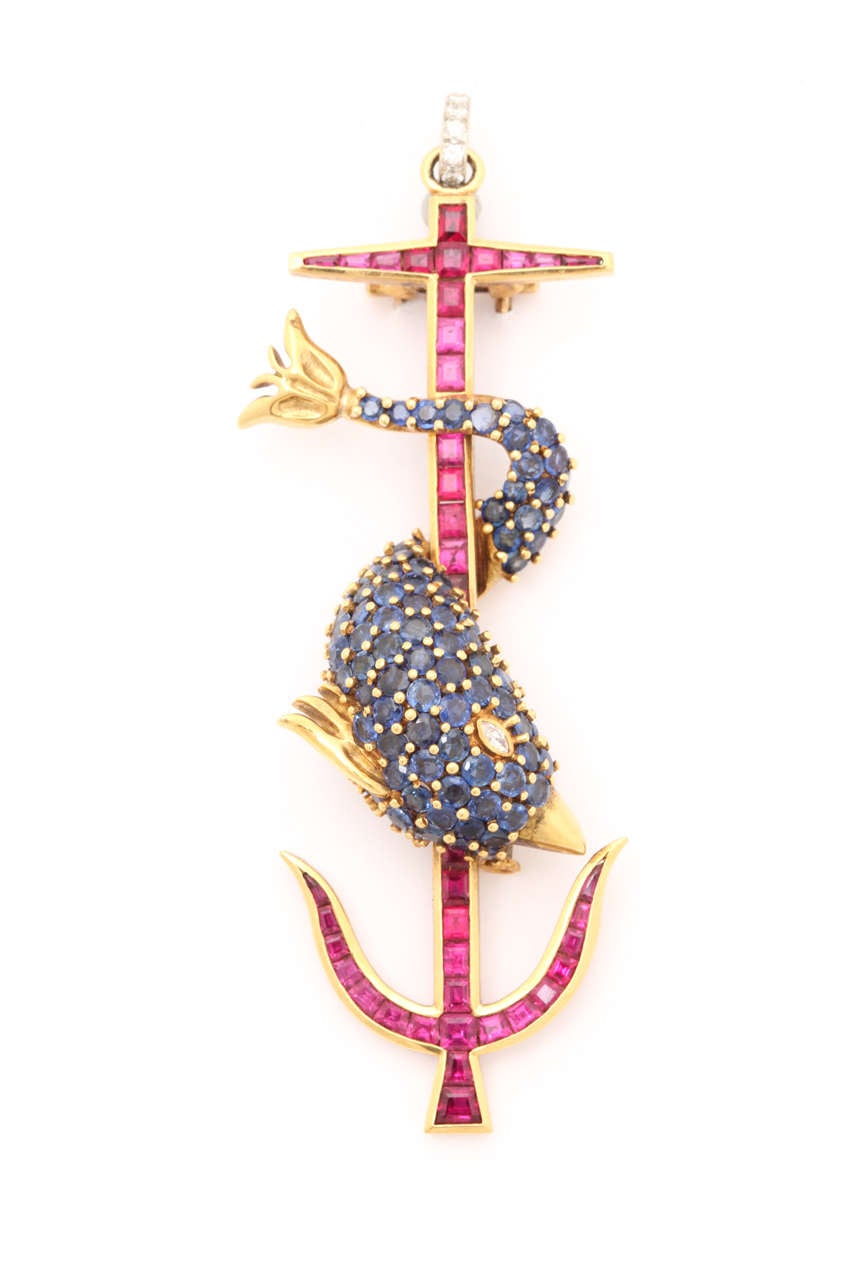 Spectacular one-of-a-kind  ruby,sapphire and diamond anchor pin. This symbol has been used since Roman times meaning "more haste, less speed". The rubies,5.35cts, each individually cut to fit the anchor shaped mounting are of an