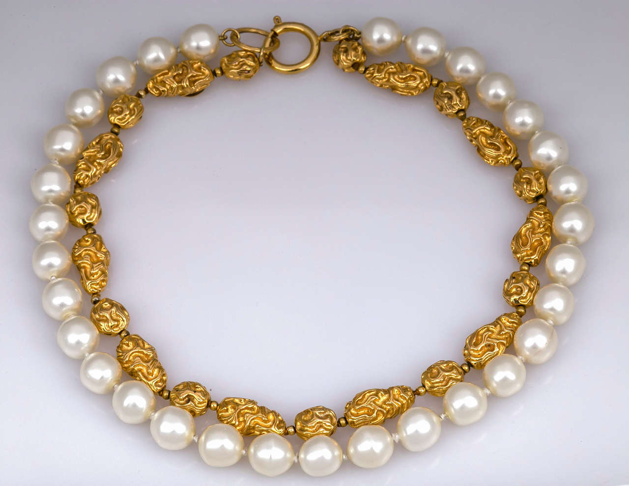 Chanel necklace two strands faux pearls and gilt nuggest.