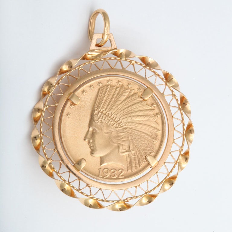 An 18 kt gold Indian Head $10 coin surrounded by a 18 kt gold pendant surround for a necklace
