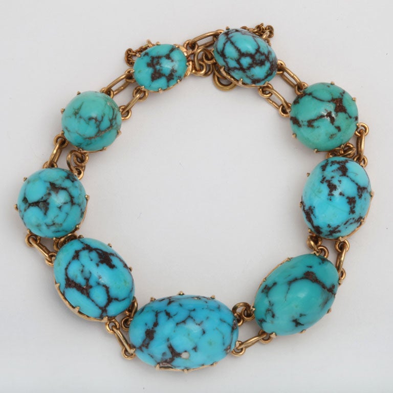 18Kt Yellow Gold Bracelet Prong set with Polished Matrix Turquoise. Bright  blue color with spider Black Matrix