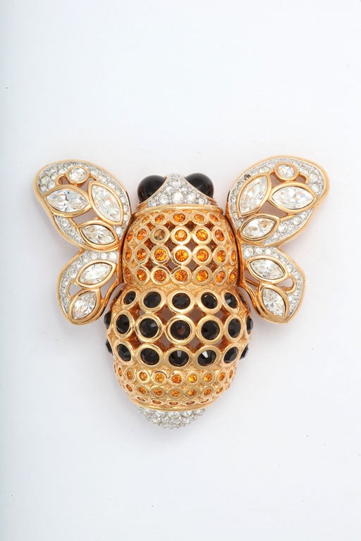 Huge, beautifully detailed goldtone bee brooch decorated with Swarovski crystals. Two small stone are missing.