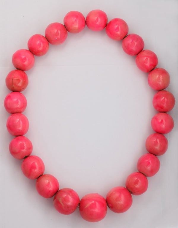 Pinky-coral colored handmade beads. Color is very translucent and irregular which adds to the beautiful handcrafted look. Largest bead is 1 1/2