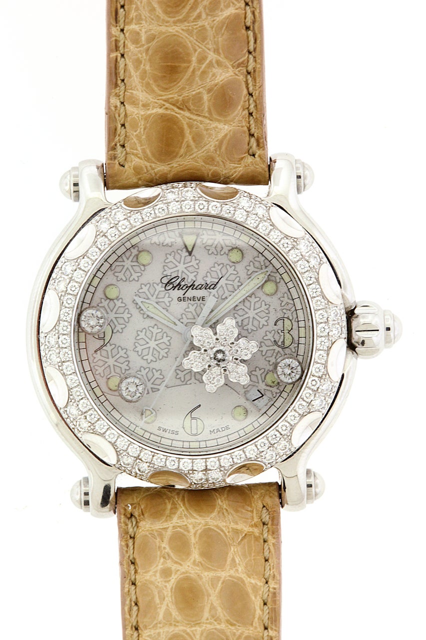 Stainless steel Chopard lady's Happy Sport Snowflake, Ref. 28/8946, circa 2005, water-resistant, center seconds, tonneau, stainless steel and diamond set quartz wristwatch with one ‘floating’ snowflake, with a steel Chopard buckle. 

The 38mm case