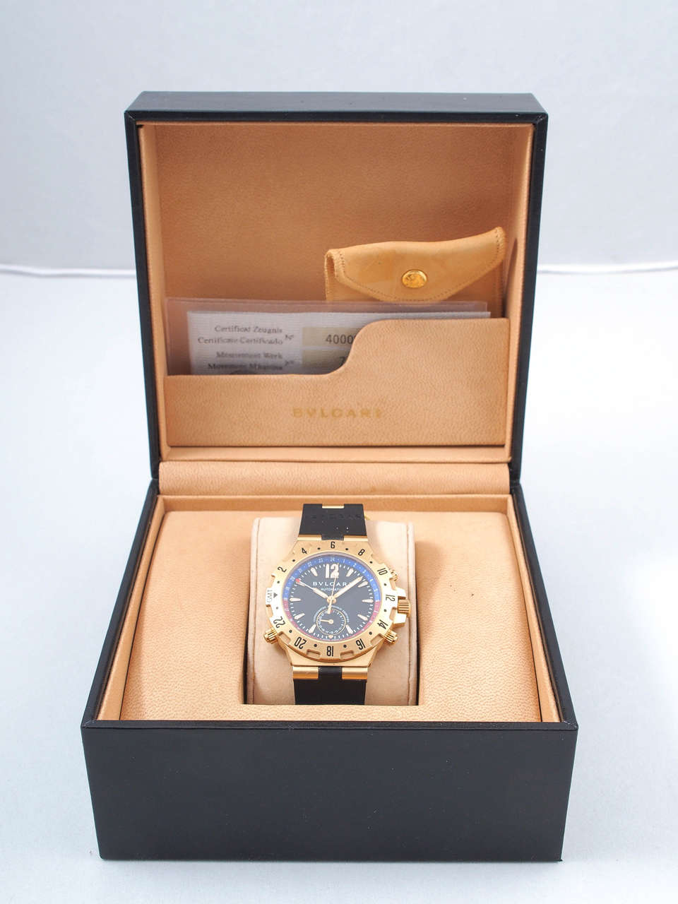 Bulgari 18k yellow gold Diagono GMT wristwatch, number 400094767

Movement: Automatic
Case: 40mm, black dial with blue and red inner bezel, luminous hands and hours
Features: Three-time-zone GMT, 42-hr power reserve
Bracelet: Black Rubber with