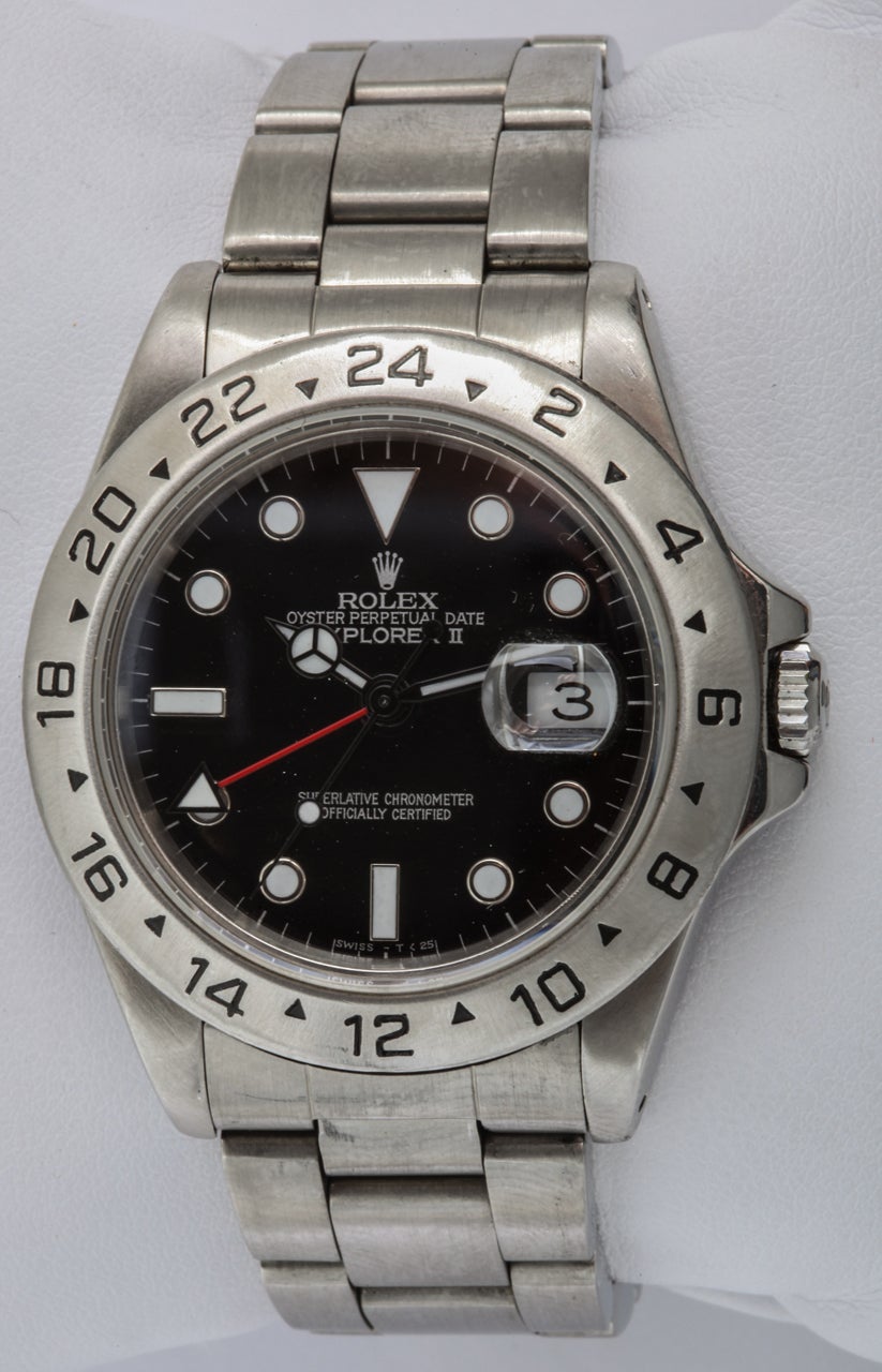 Rolex stainless steel Oyster Perpetual Explorer II wristwatch. Black dial with luminous hour markers, mercedes-style hands and red 24-hour hand. Sapphire crystal with cyclops lens over the date aperture. Features a fixed 24-hour bezel. Automatic,