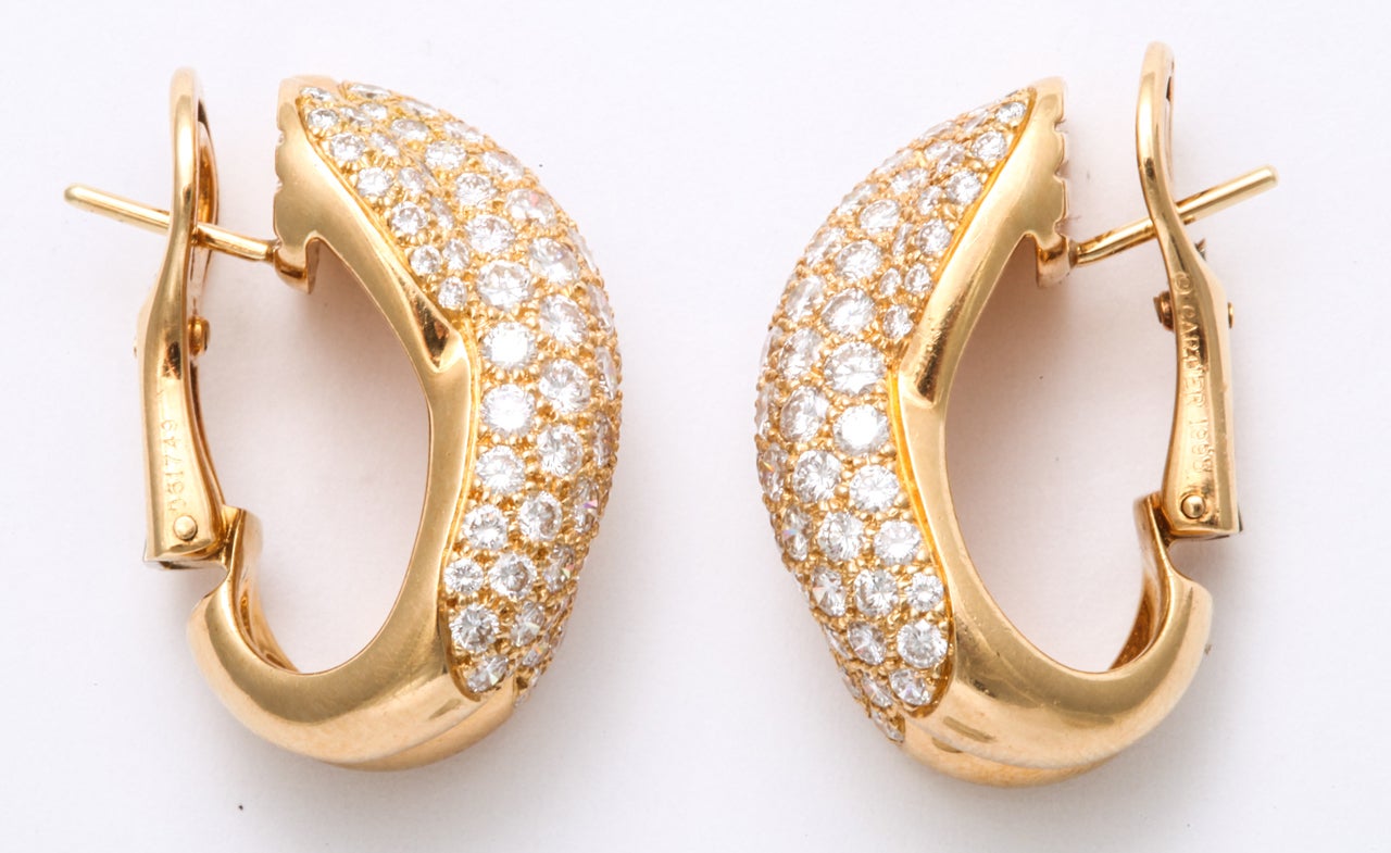 Women's CARTIER Diamond Gold Crossed Omega Earrings For Sale
