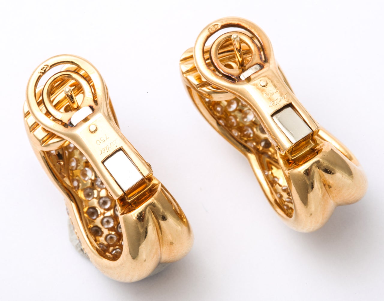 CARTIER Diamond Gold Crossed Omega Earrings For Sale 1