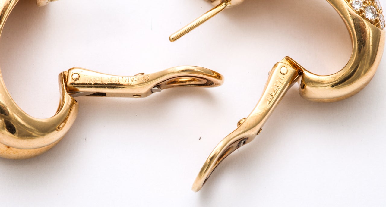 CARTIER Diamond Gold Crossed Omega Earrings For Sale 3