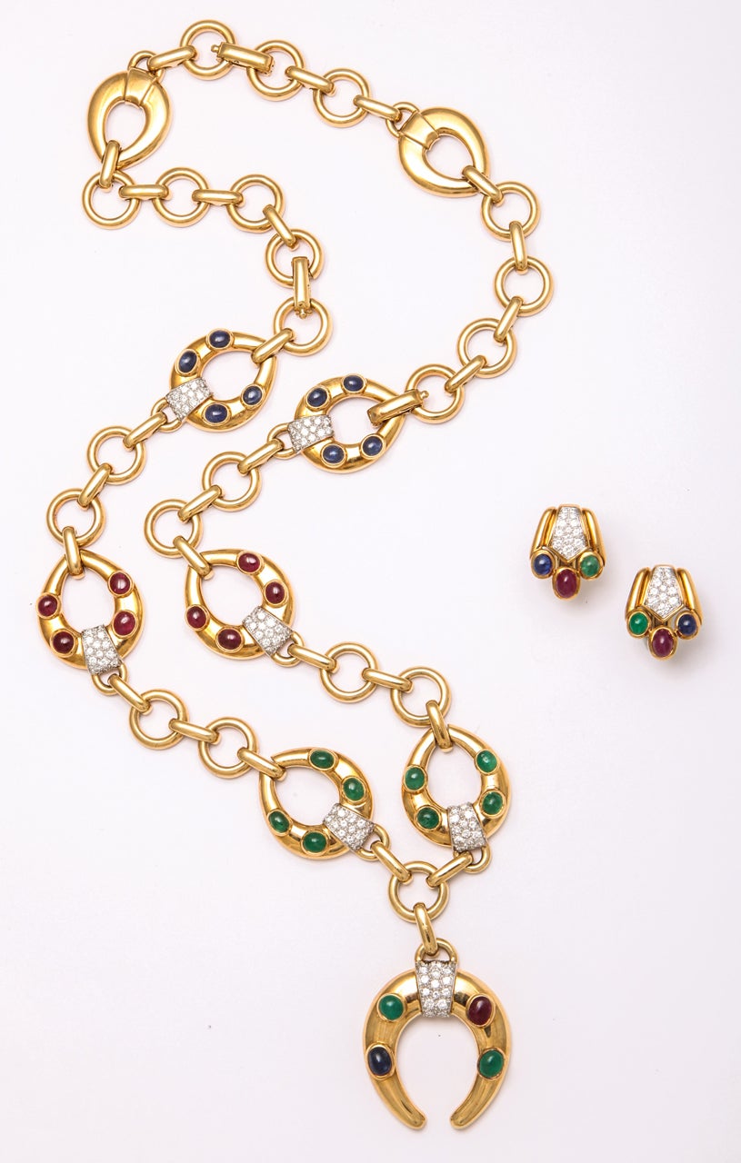 DAVID WEBB 18K Gold Platinum Diamond, Ruby, Emerald and Sapphire Earrings and Necklace Set.     
The necklace composed of circular and pear-shaped links accented by cabochon sapphires, rubies and emeralds, and by round diamonds weighing