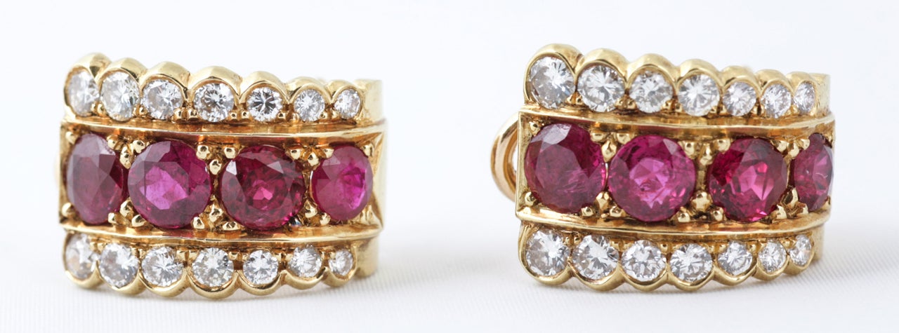 Gold mounted pair of ruby and diamond creole shaped earrings, c1972.