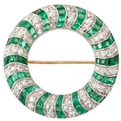 1920s  emerald and diamond open circle brooch