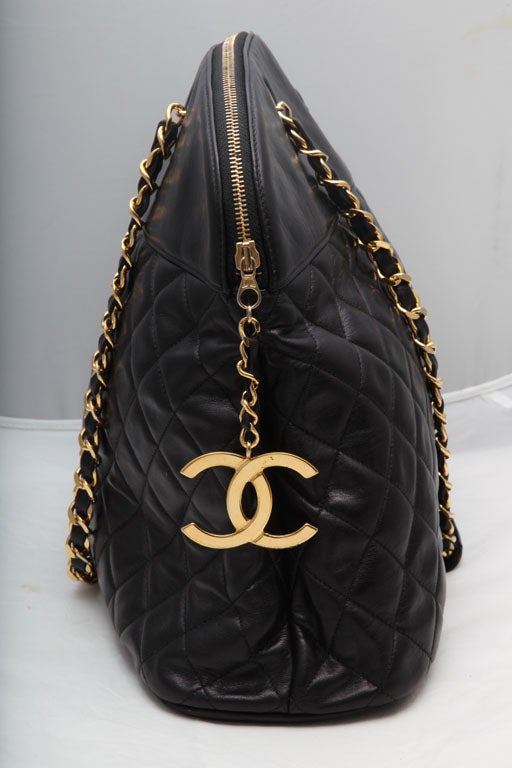 Beautiful Chanel large bowling bag with quited details, iconic shoulder strap and CC charm.