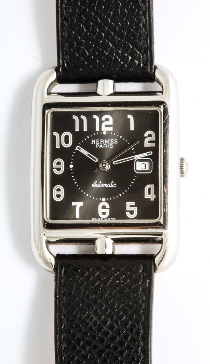 A classic automatic Hermes Cape Cod steel black dial face ladies wrist watch with adjustable black leather Hermes watch strap.
