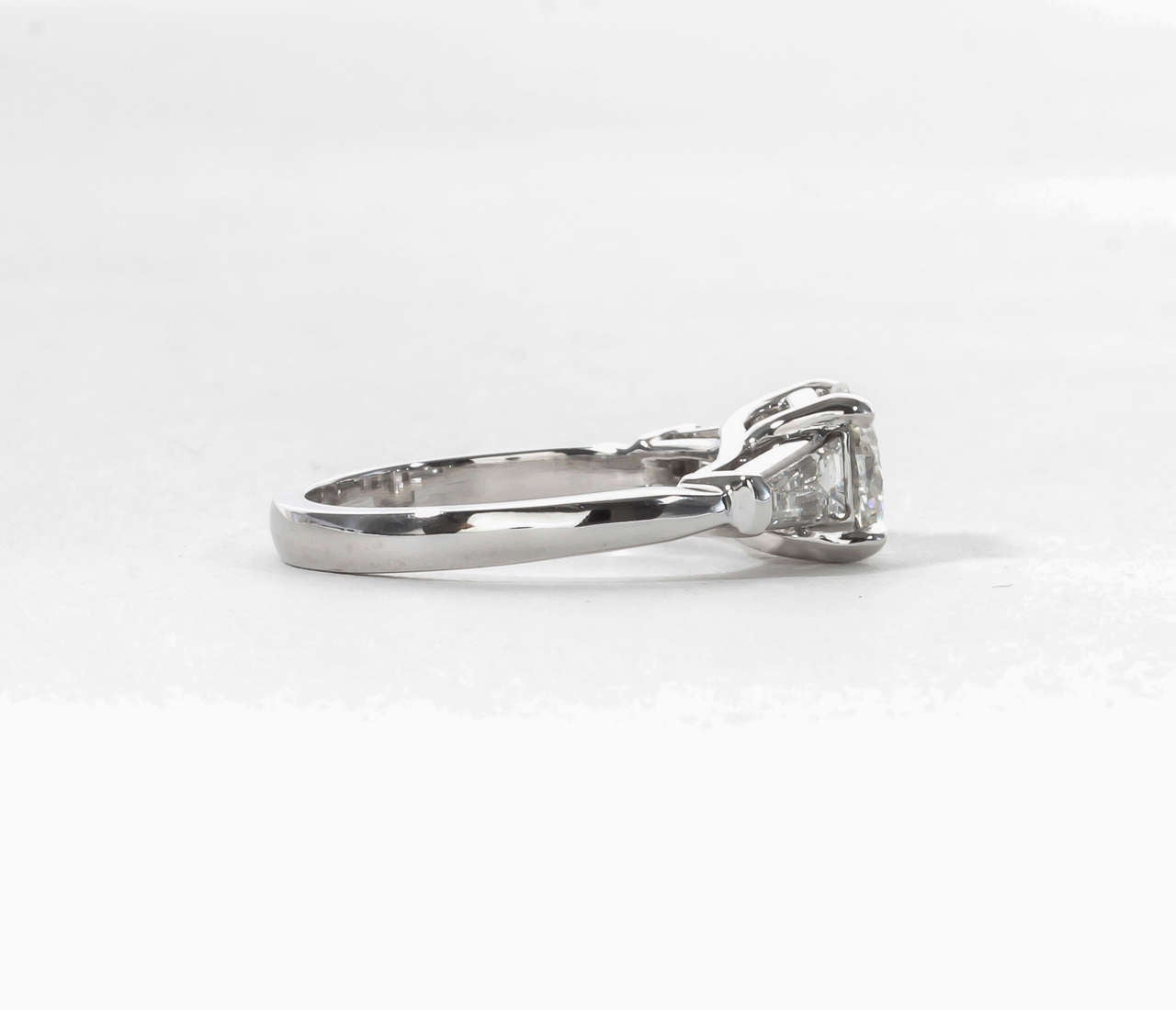 round brilliant with tapered baguettes engagement ring