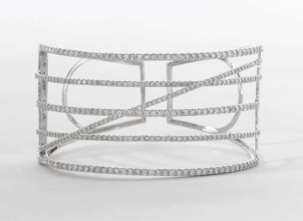 A gorgeous bangle you will get a lot of use out of! 

6.75 carats of round brilliant cut diamonds F color VS clarity set in 18k white gold.