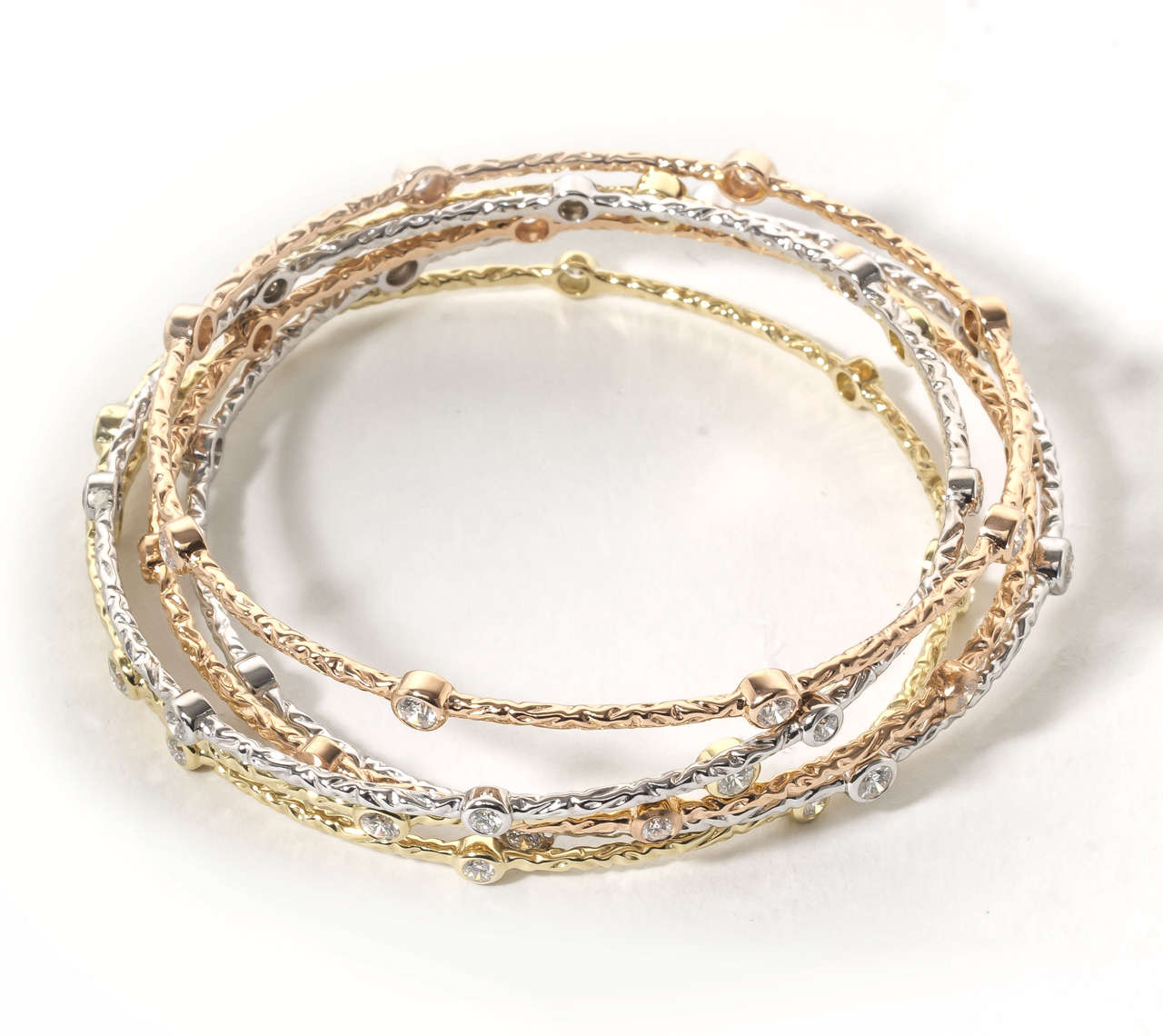 An amazing set of 6 multicolored and size diamond slip on bangles !!

(1) white gold with bangle .45 carats of white round brilliant diamonds
(1) white gold with bangle .90 carats of white round brilliant diamonds
(1) yellow gold with bangle .45