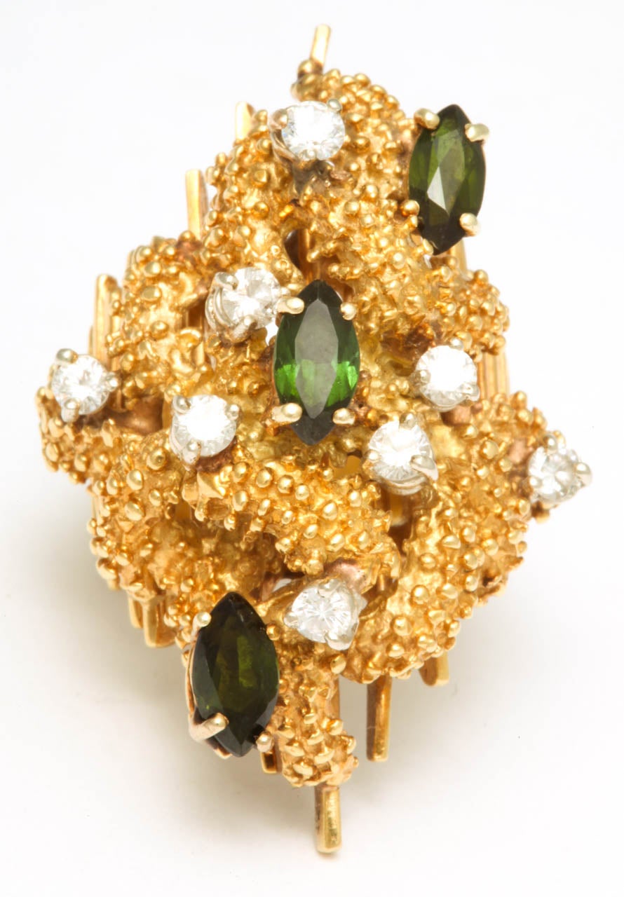 Large 18kt Yellow Gold Ring adorned with 8 full cut - clean & super white Diamonds & accented by 3 asymmetrically placed marquise shaped Tourmalines.  Reminiscent of Kuchinsky/ London.  Overpowering & impressive.  Very Mod