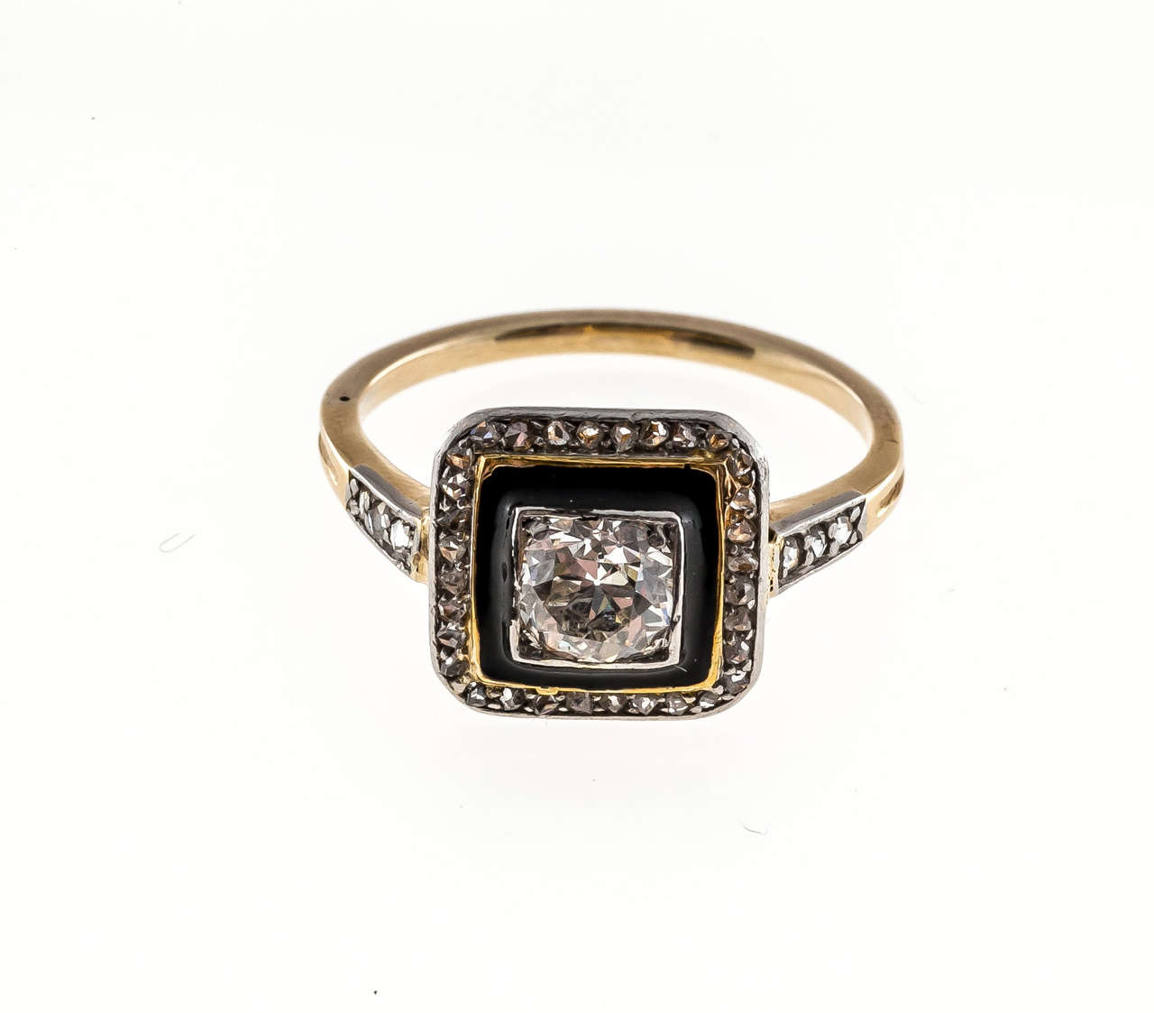The shoulders and outer rim are set with all original rose cut diamonds.  The center is set with a beautiful well cut European cut diamond.  Around the center diamond is a black enamel rim.  This makes for a striking Art Deco Design.  Very good