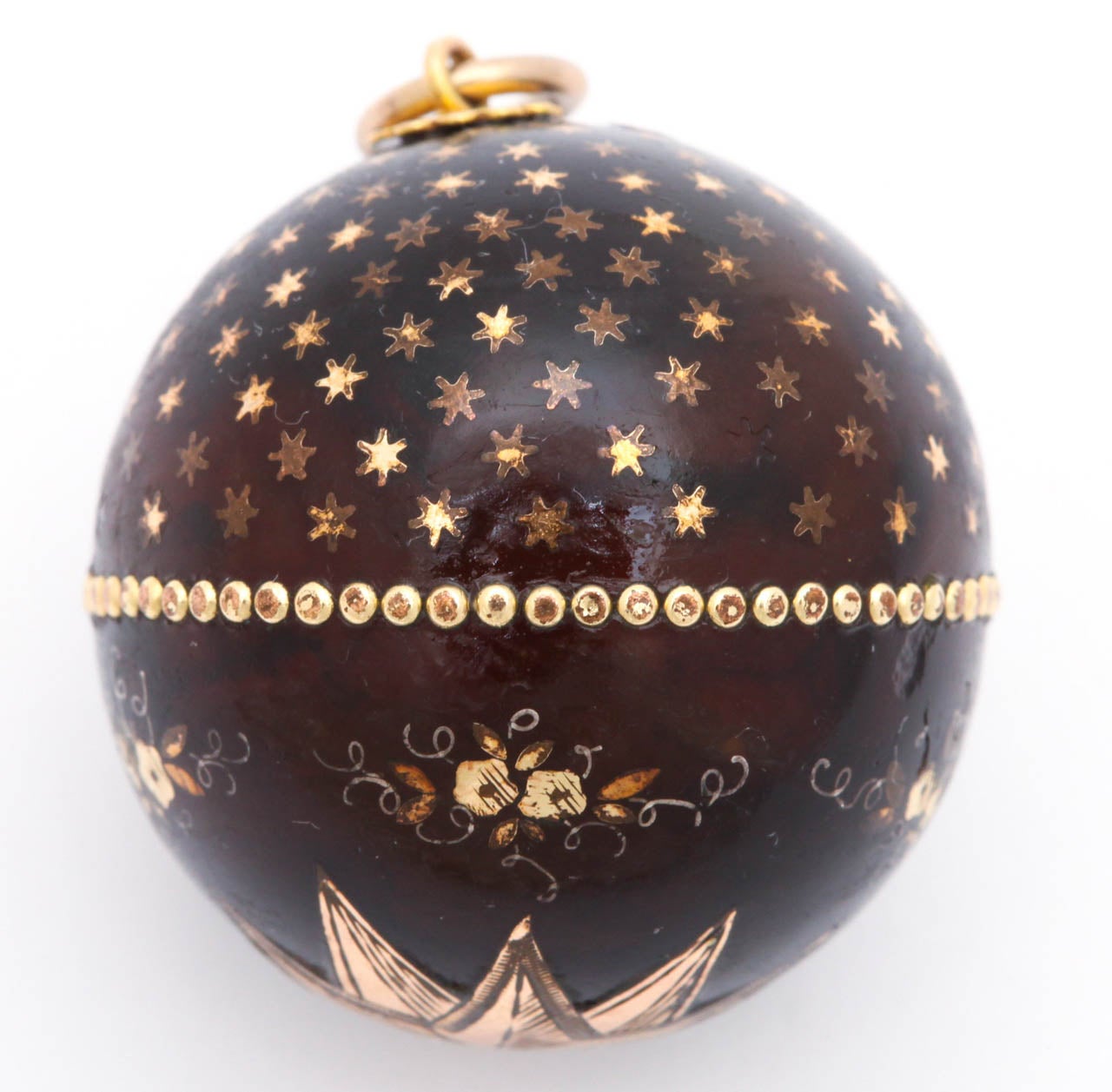 Gold stars and flowers with tendrils were incised in the shed shell of the Hawksbill tortoise during the Victorian years 1870-1890. As in the night sky, some stars are not bright, others are bright.  Complicated designs such as this were time