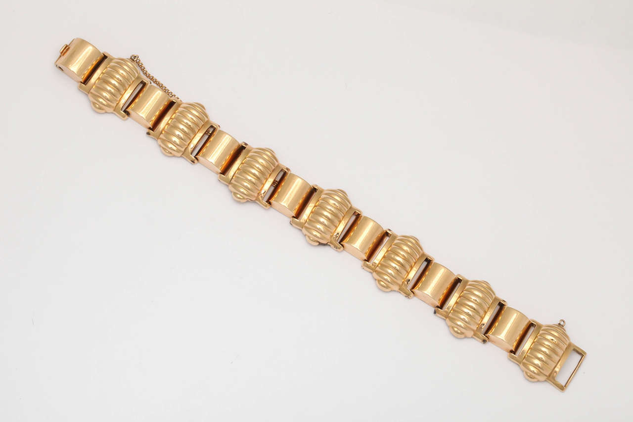 Hot 50's articulated Bracelet wiht alternating Melon shaped & half round barrel shaped elements.  Great weight and size for this hollow link Bracelet which can be worn alone or stacked with others.  makes a statement whichever way you wear it.