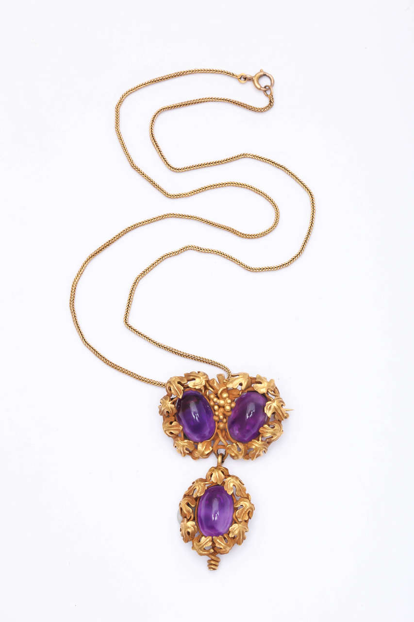 Exquisite Cabochon Amethyst Pendant Brooch in rich 18kt Yellow Gold Grape Leaf setting.  Can be worn as Brooch or suspended from woven Gold chain.  Ca 1870-80.  Scarlett could have easily worn this on one of her trips to Atlanta - whilst visiting