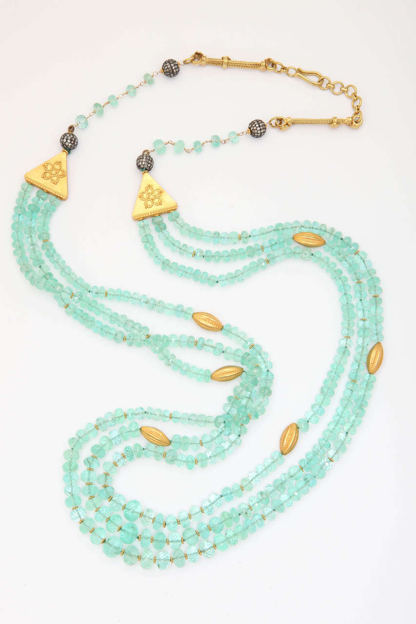 Fit for royalty, this spectacular 3 strand faceted emerald and 18 kt bead necklace set would be an excellent addition to your jewelry collection. The faceted beads in this set, are a gorgeous soft cool green, very clear and sparkle beautifully. The