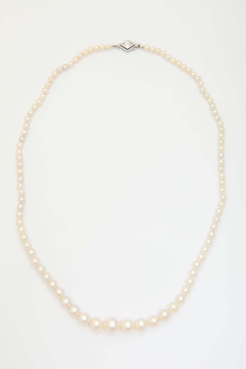 Artisan Graduated Cultured Pearl Necklace with Diamond Gold Clasp For Sale