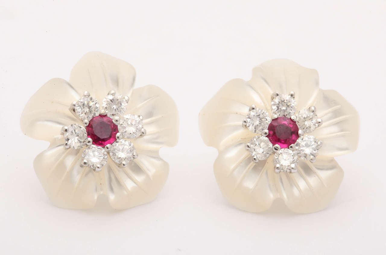 You can achieve two different looks with these earrings. The centers make a great on-the-ear cluster earring for more casual wear.  Put the stud post through the mother-of-pearl flower and it's a completely different look.The top quality 1.8 ct 