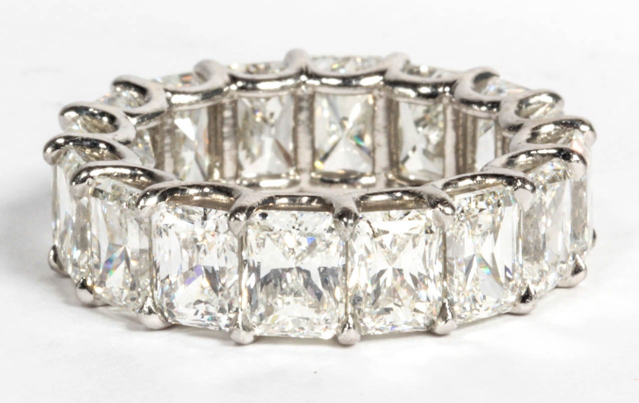Beautiful radiant cut diamond eternity band. Each diamond measures just under 1 carat. 

This band has over 12.50 carats set in a handmade platinum U shaped setting.

Diamonds are G color VS clarity.

Size 6.5
