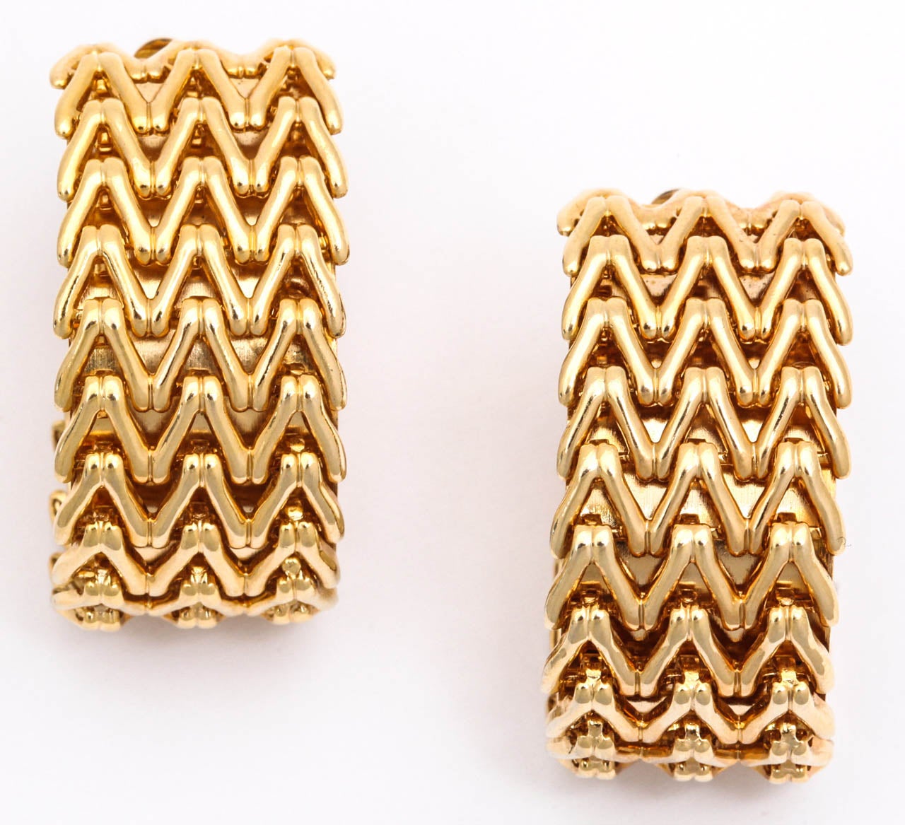 Large chevron patterned gold tone hoop clip earrings