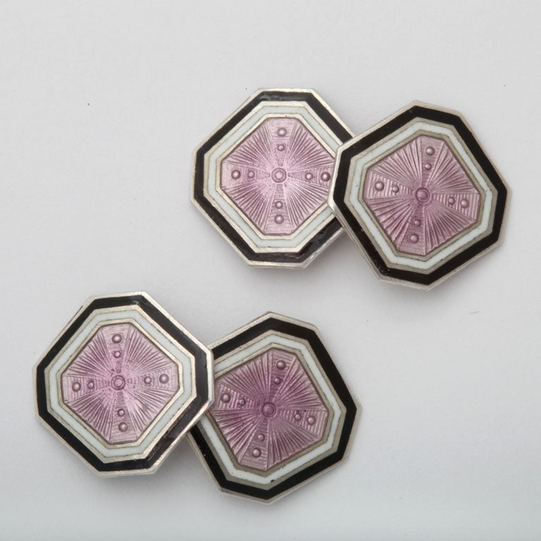 American Art Deco sterling silver cufflinks with central purple guilloche enamel framed in a white and black enamel border.

Hallmarks: STERLING/ F & B

*Variety of other Art Deco sterling silver and guilloche enamel cufflinks available.