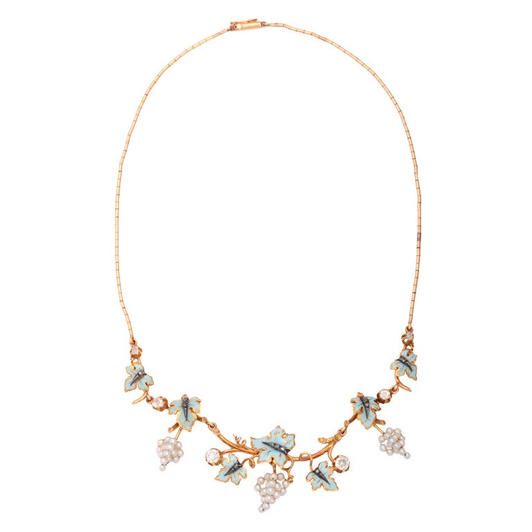 Exquisite Victorian Natural Pearl and Diamond Necklace featuring a graduating floral design centrally set with six old mine diamonds interspersed  with polychrome enamel  foliage studded with rose cut diamonds, accented by stylized grape pendants